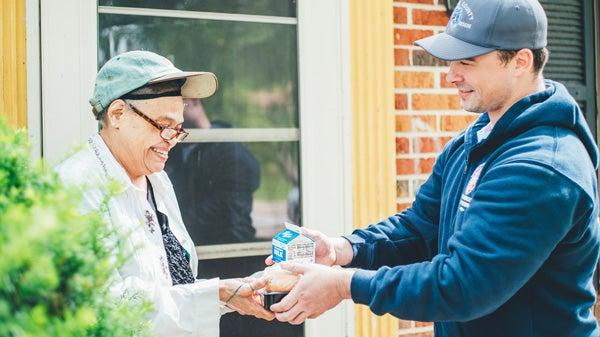 Food delivery to older woman