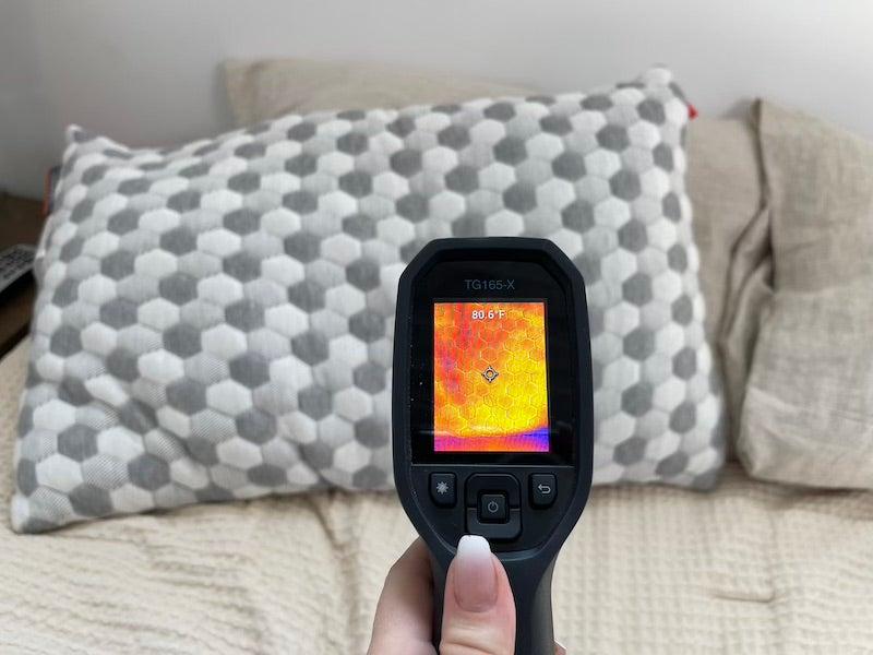 A temp gun shows the Layla Kapok’s retained heat after testing.