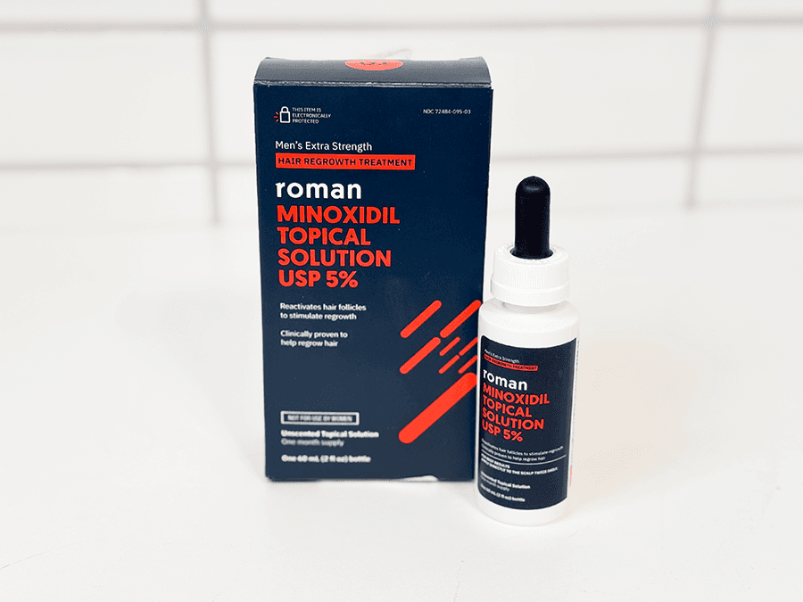Roman Minoxidil Topical Solution box and bottle on a white countertop