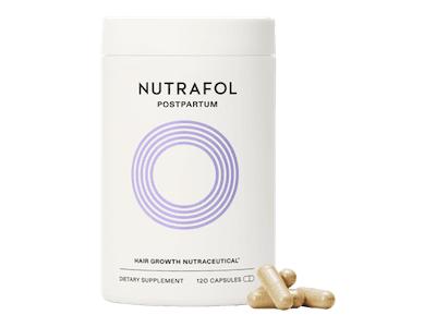 A bottle of Nutrafol Postpartum supplements