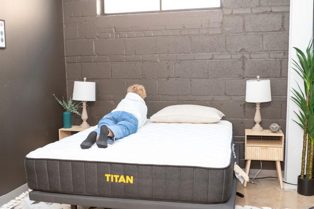 woman rolling over on the Titan Plus mattress