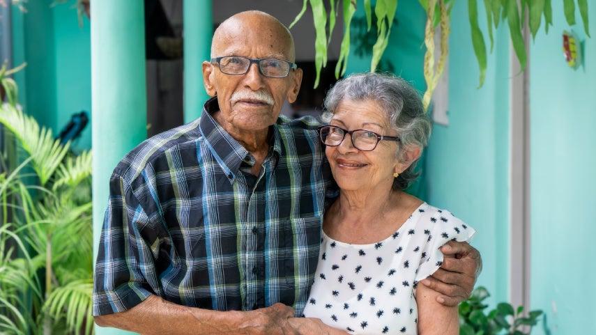 smiling older Hispanic man and woman