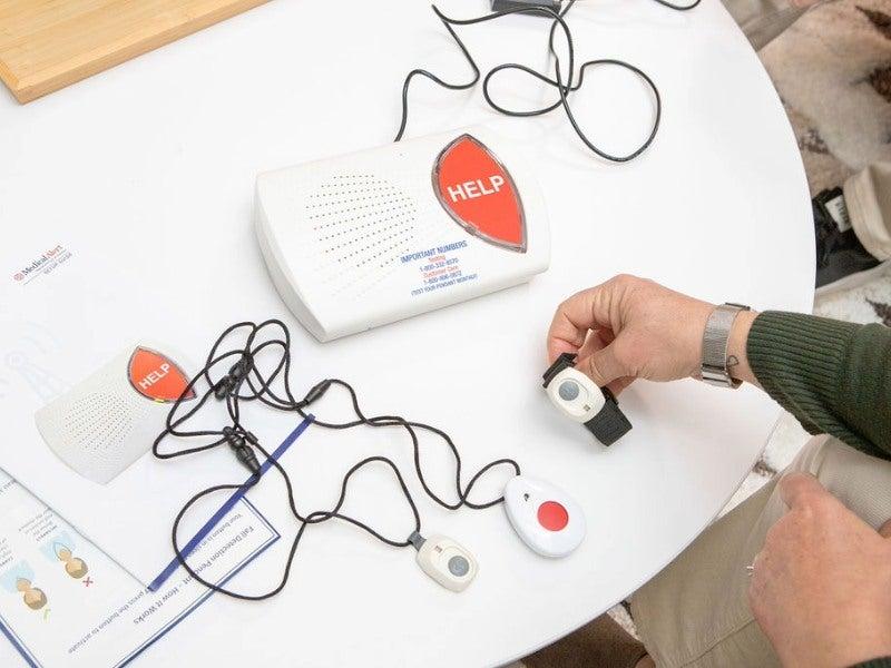 The Medical Alert Home device unboxed on a table