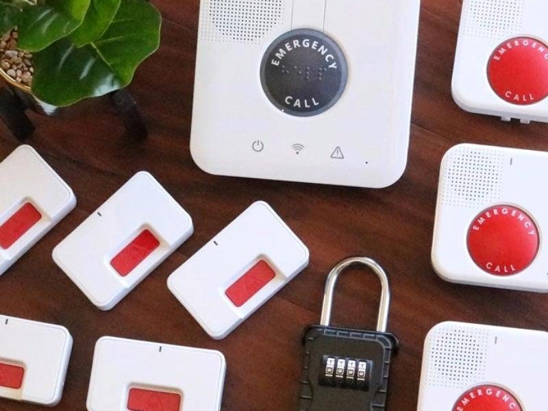 The GetSafe base station, 5 standard wall buttons, 3 voice-activated wall buttons, and a lockbox