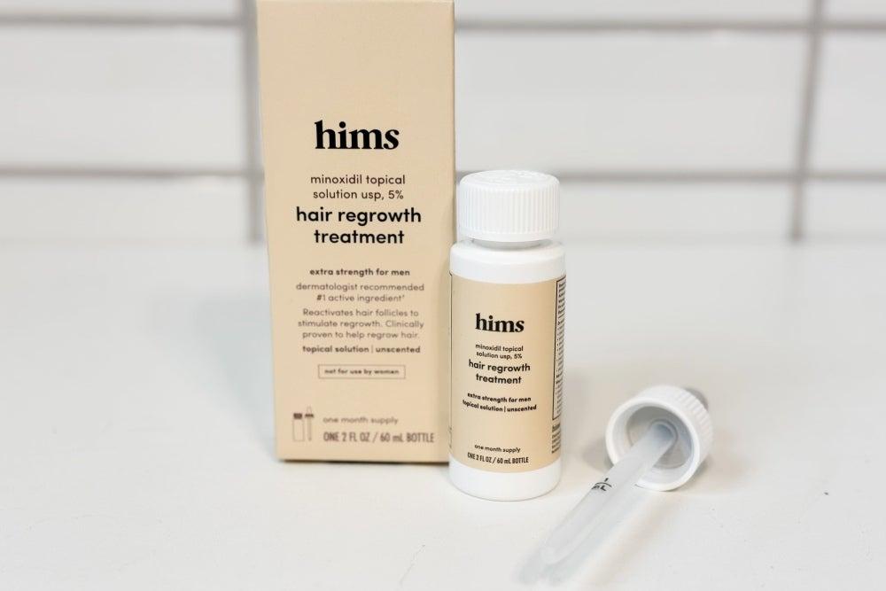 Hims hair regrowth serum bottle, box, and dropper