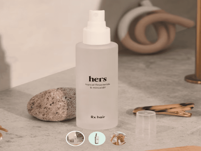 Frosted bottle of 'hers' hair solution with a pump top on a bathroom counter.