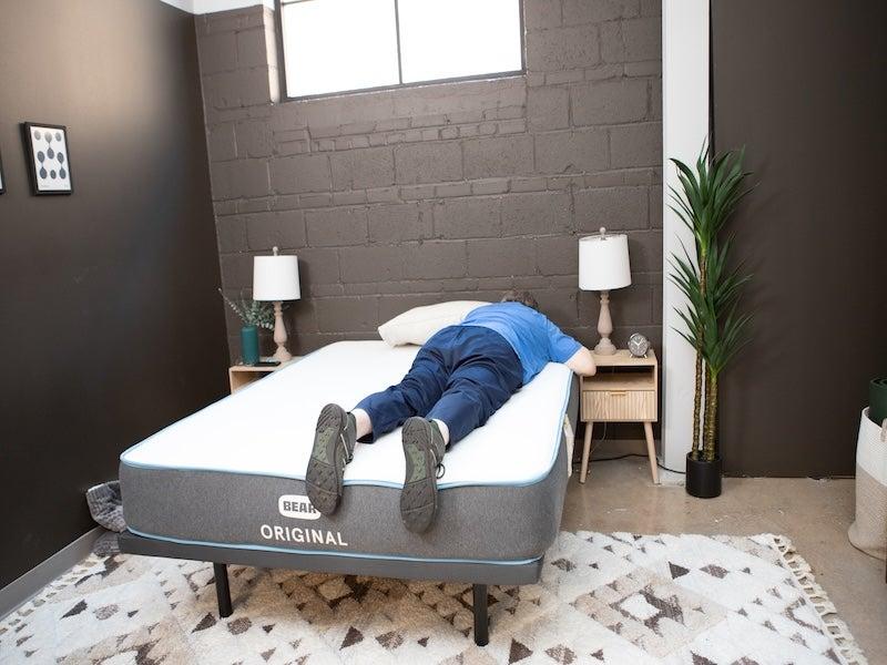 A man lies face down on the Bear Original Memory Foam mattress