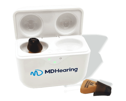 MDHearing hearing aids, one inside charging case and one just in front of the case