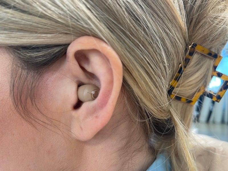 Audien Atom 2 hearing aids in tester’s ear