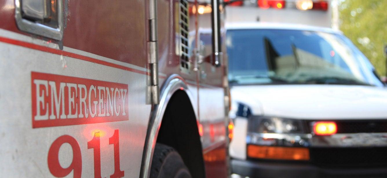 A fire truck and ambulance arrive on the scene first, responding to a 9-1-1 call.