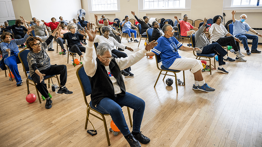 older adults in chair exercise class