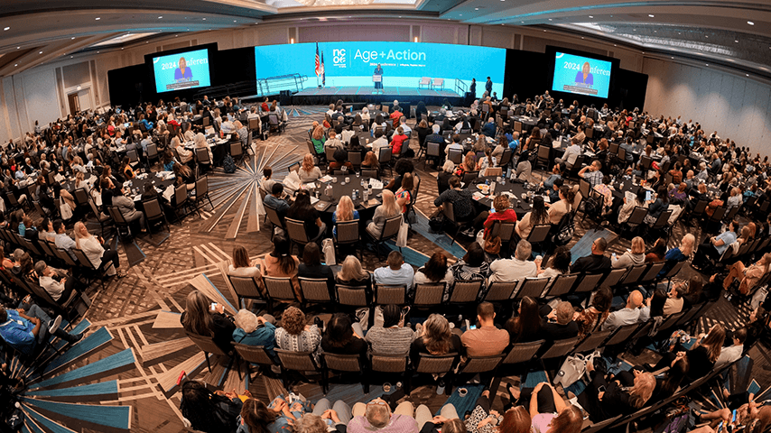 overhead view of audience and stage at Age+Action conference