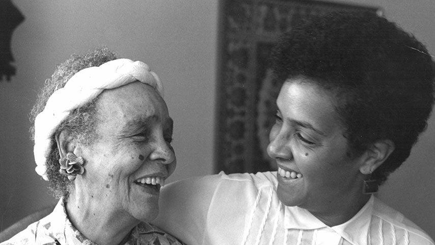 smiling older and younger black women