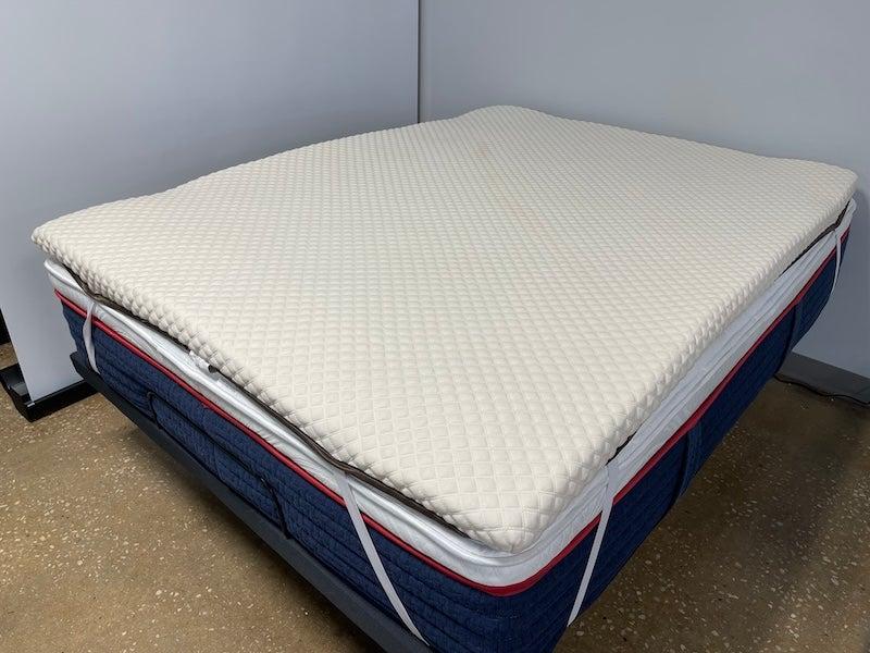 The Nolah Luxury Firm mattress topper on a mattress