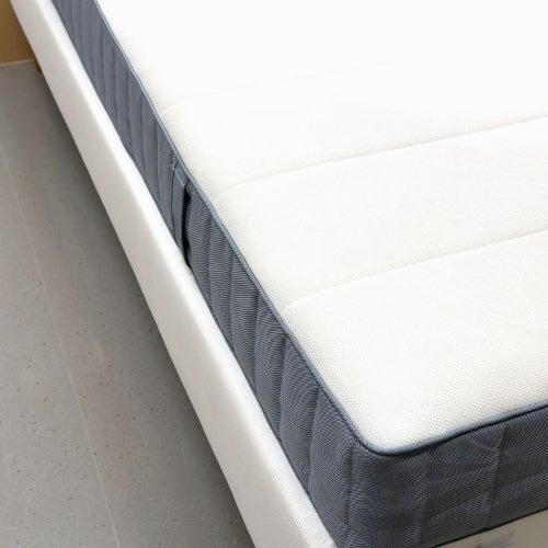 Helix mattress with no sheet on a white base