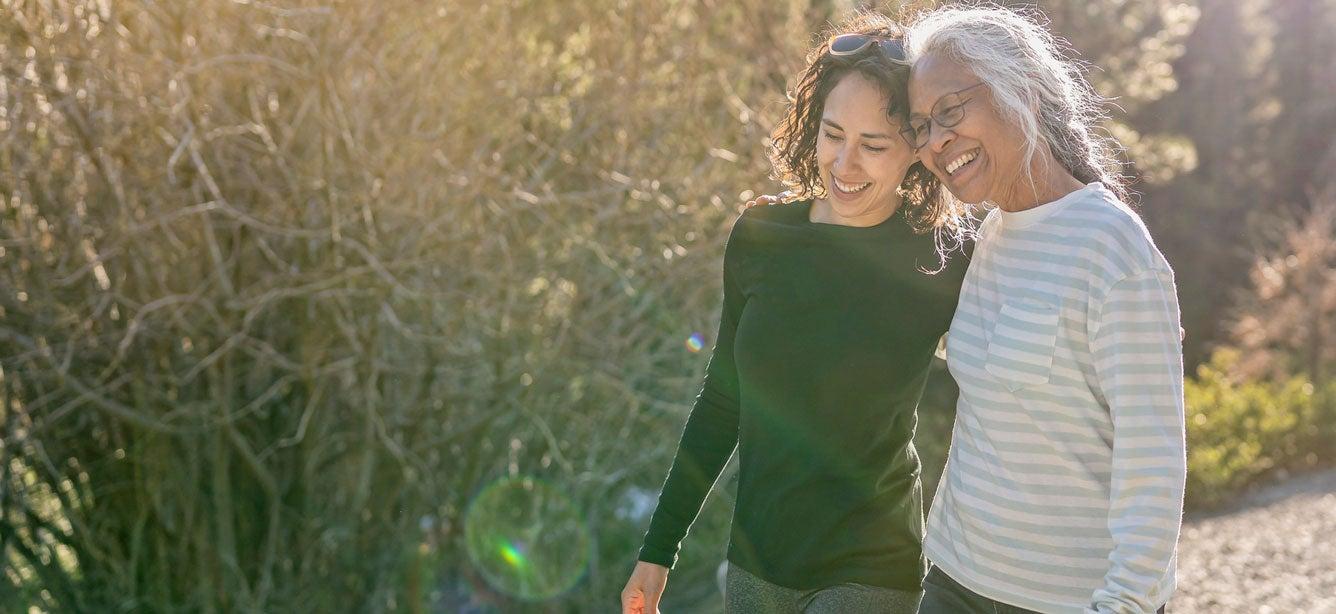 smiling women walking together