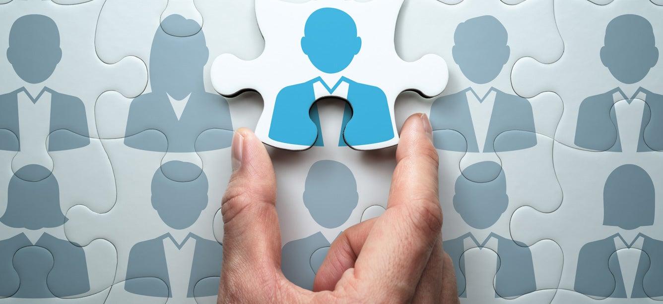 A puzzle that has a piece missing that's being put in place. The puzzle is a network of people, with the missing piece being key to their success.